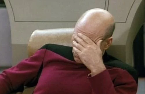 Captain Picard covering his face in frustration