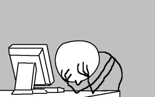 Rage-comic character facepalming at a computer desk