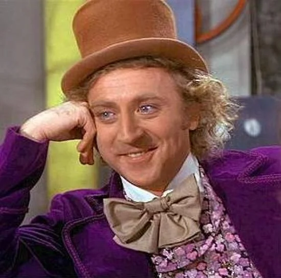 Gene Wilder as Willy Wonka resting his chin with a condescending smile