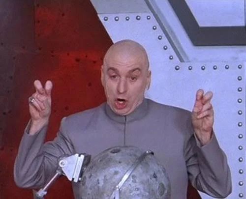 Dr Evil making air quotes beside a moon model