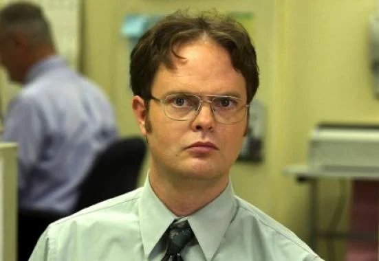 Dwight Schrute staring intensely at the camera in the office