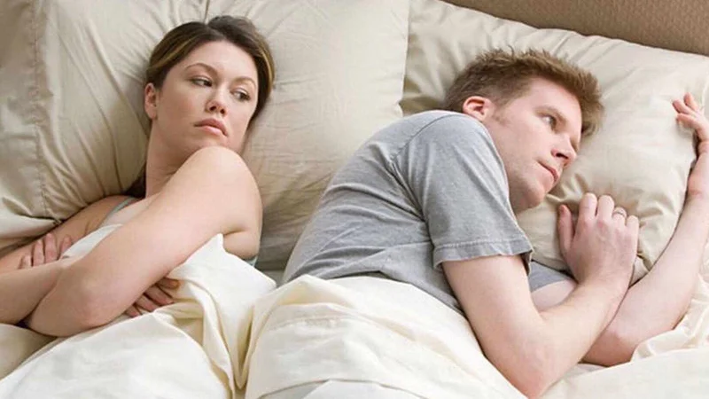 I Bet He's Thinking About Other Women meme template: a couple in bed, her annoyed and him staring at the ceiling