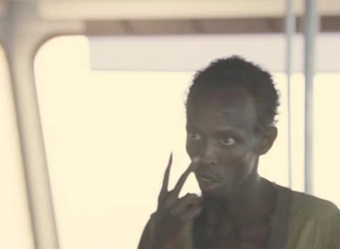 Somali pirate from Captain Phillips pointing to his eyes meme template
