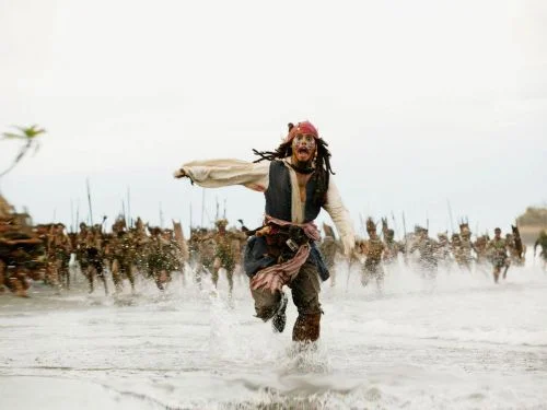 Jack Sparrow running from a tribe on the beach meme template