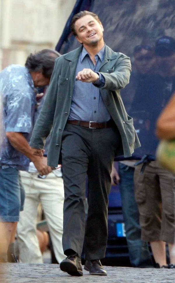 Leo Strutting meme template: Rick Dalton (Leonardo DiCaprio) walking confidently with a drink and cigarette