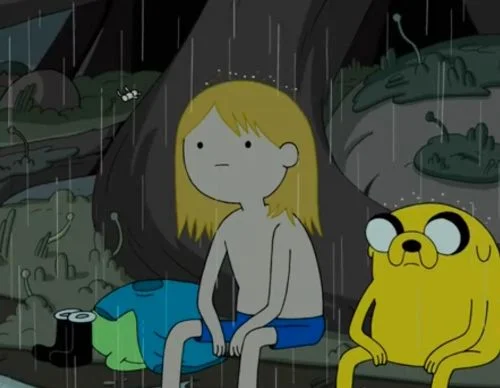 Finn and Jake sitting in the rain looking defeated from Adventure Time
