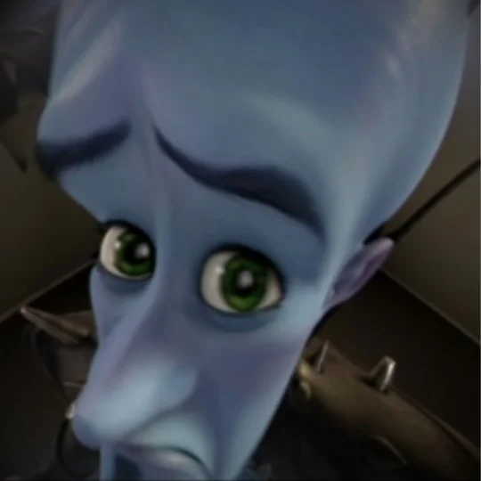 Megamind Peeking meme template: the blue alien villain leaning in with an arched eyebrow and a knowing stare