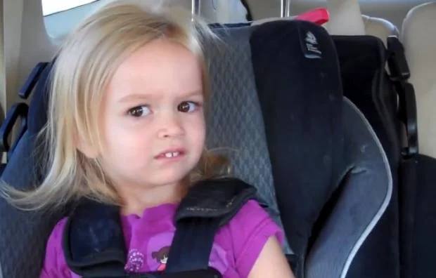 Toddler Chloe giving a skeptical side-eye meme template