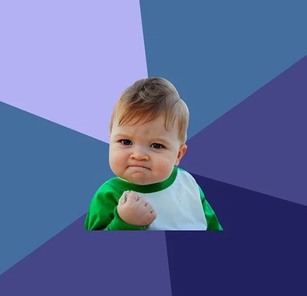 Success Kid meme template: a toddler on a beach clenching a fistful of sand with a determined look